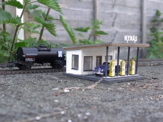 A 'Nyn�s' tank wagon on static display behind the 'Nyn�s' petrol station